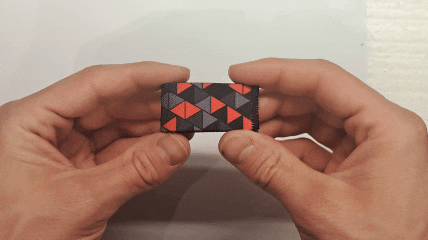 Dual-sided Squote Chest Strap Keepers securely attached to skydiving straps, showcasing premium quality and secure fit.