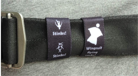 Dual-sided Squote Chest Strap Keepers securely attached to skydiving straps, showcasing premium quality and secure fit.